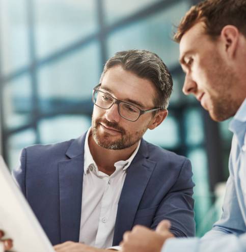Businessmen, meeting and finance discussion with tablet stock market research or trading at office. Business people, broker or accountant with technology for financial profit, report or investment.